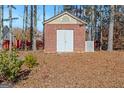 Brick storage shed in the backyard of the property at 360 Kaleb C, Mcdonough, GA 30252