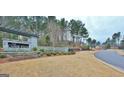 The Canoe Club entrance, featuring a stone and wood sign at 145 Dockside Dr # 396, Fayetteville, GA 30215