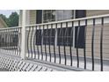 Black metal porch railing with curved accents at 2477 Briar Valley Way, Dacula, GA 30019