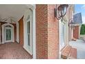 Side entrance with brick facade and ornate columns at 2650 Riverfront Dr, Snellville, GA 30039