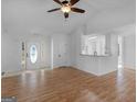 Open living space with hardwood floors and vaulted ceiling at 135 Kimbell Farm Dr, Locust Grove, GA 30248