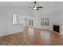 Bright living room with hardwood floors and fireplace at 135 Kimbell Farm Dr, Locust Grove, GA 30248