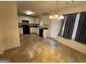 Eat-in kitchen with black appliances and tile floor at 190 Wynfield Dr, Covington, GA 30016