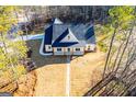 Aerial view showing house, driveway, and surrounding trees at 16 Edgewater Dr, Temple, GA 30179