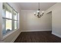 Bright dining room with hardwood floors and chandelier at 5635 Laney Dr # Ln34, Rex, GA 30273