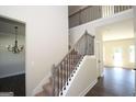 Elegant staircase with wrought iron railings leading to the second floor at 5635 Laney Dr # Ln34, Rex, GA 30273