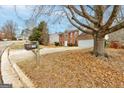 House with a large front yard and a tree in the foreground at 6191 Valley Green Rd, Lithonia, GA 30058