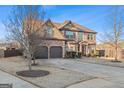 Two-story house with a three-car garage, driveway, and landscaping at 704 Kitts Ct, Mcdonough, GA 30253