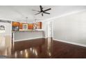 Open concept kitchen with hardwood floors, stainless steel appliances and an island at 3213 Woodlynne Way, Atlanta, GA 30340