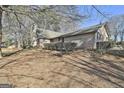 Side view of brick ranch house with landscaping at 2984 Walt Stephens Rd, Jonesboro, GA 30236