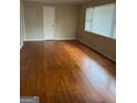 Large living room with hardwood floors and neutral walls at 1310 Celia Way, Decatur, GA 30032