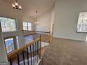 Two story foyer with open staircase and view into the living room and dining area at 3279 Greenhill Dr, Villa Rica, GA 30180