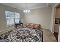 Bright dining room with large window and decorative rug at 7019 Blue Sky Dr, Locust Grove, GA 30248