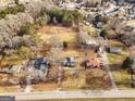 Aerial view showing house and surrounding properties at 60 N East Main St, Hampton, GA 30228