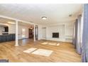 Spacious living room, hardwood floors, fireplace, and open floorplan at 103 Pine Pt, Peachtree City, GA 30269