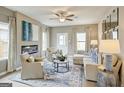 Cozy living room featuring a modern fireplace, elegant seating, and decor accents at 1467 Trellis Court (Lot 5), Hampton, GA 30228