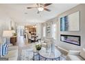 Bright open-plan living area with modern fireplace, stylish seating, and wood flooring at 1467 Trellis Court (Lot 5), Hampton, GA 30228