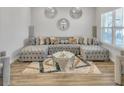 L-shaped sectional sofa, coffee table, and decorative pillows at 5626 Wyncreek Sw Cir, South Fulton, GA 30331