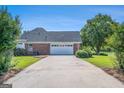 Spacious driveway leading to a two-car garage with ample parking space at 600 English Ct, Mcdonough, GA 30252