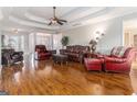 Living room with hardwood floors and leather furniture at 600 English Ct, Mcdonough, GA 30252