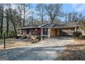 Ranch home with covered carport and landscaping at 5546 Stoneybrook Se Ct, Mableton, GA 30126