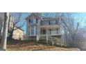 Two-story home featuring a welcoming front porch and well-maintained landscaping on a generous lot at 2618 Windage Sw Dr, Marietta, GA 30008