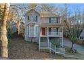 Charming two-story home featuring a welcoming front porch and well-maintained landscaping on a generous lot at 2618 Windage Sw Dr, Marietta, GA 30008