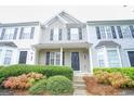 Two-story townhome with gray and white siding, black shutters, and landscaping at 6527 Arbor Gate Sw Dr # Bldg 12, Mableton, GA 30126