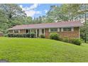 Front view of brick ranch house at 200 Old Stagecoach Dr, Stockbridge, GA 30281