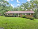 Ranch house with a green lawn at 200 Old Stagecoach Dr, Stockbridge, GA 30281