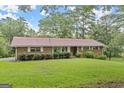 Brick ranch home on a grassy lot at 200 Old Stagecoach Dr, Stockbridge, GA 30281