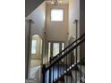 Two-story foyer with hardwood floors and elegant staircase at 1830 Alder Tree Way, Dacula, GA 30019