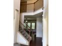 Open staircase with wrought-iron railing at 1830 Alder Tree Way, Dacula, GA 30019