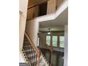 Elegant staircase overlooking the living room at 1830 Alder Tree Way, Dacula, GA 30019