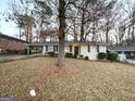 Brick ranch home with a large front yard and mature trees at 2304 Springdale Sw Cir, Atlanta, GA 30315