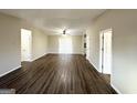 Spacious living room with dark hardwood floors at 3993 Flakes Mill Rd, Decatur, GA 30034