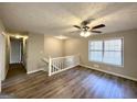 Spacious living room with hardwood floors and loft at 3786 Glen Mora Dr, Decatur, GA 30032