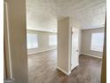 Open living area with wood-look flooring and neutral tones at 3205 Cadiz Cir, South Fulton, GA 30349