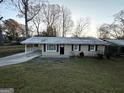 Charming ranch home with a covered porch and spacious yard at 3226 Browns Mill Se Rd, Atlanta, GA 30354
