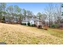 Ranch style home with backyard and wooded area at 123 Line Creek Way, Sharpsburg, GA 30277