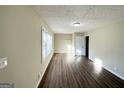 Bright living room with hardwood floors and neutral walls at 2490 Habersham Dr, Decatur, GA 30032