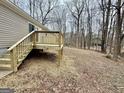 Wooden deck overlooks a wooded backyard at 58 Pinewood Dr, Carrollton, GA 30116