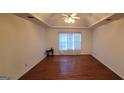 Spacious bedroom with hardwood floors and a large window at 635 Watson Bay, Stone Mountain, GA 30087