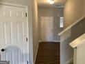 Front entry with stairs, flooring, and coat closet at 252 Magnaview Dr, Mcdonough, GA 30253