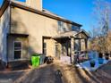 Covered patio with outdoor kitchen and seating area at 116 Telfair Ln, Mcdonough, GA 30253