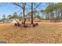 Ranch house with landscaping and trees in the yard at 206 Sandown Dr, Peachtree City, GA 30269