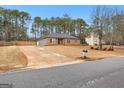 House with driveway and landscaping, nice curb appeal at 206 Sandown Dr, Peachtree City, GA 30269