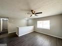 Spacious living room featuring vinyl flooring and a half-wall at 2959 Fairburn Rd, Atlanta, GA 30331