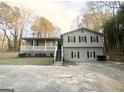 Gray sided house with stone accents and a covered porch at 1618 Old Alabama Rd, Austell, GA 30168