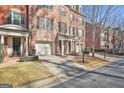 Brick townhouse with attached garage and front porch at 32 American Walk, Peachtree City, GA 30269